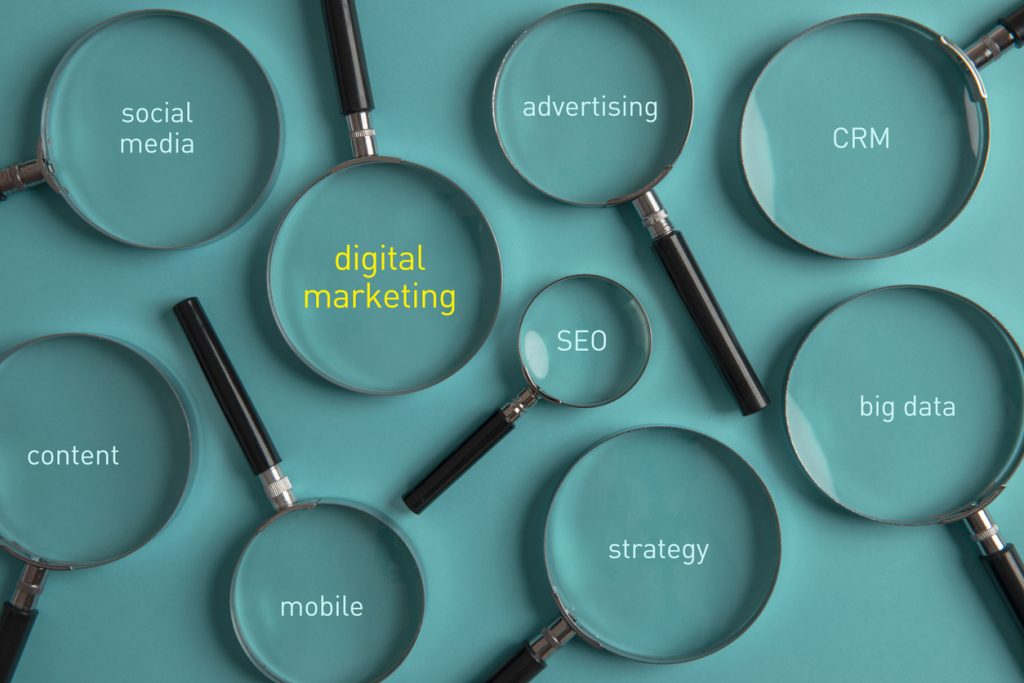 magnifying glasses on blue background concept digital marketing budget seo marketing bend oregon 